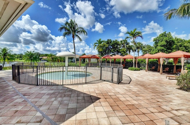 view of pool featuring a gazebo and a patio