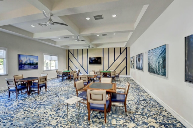 dining space featuring carpet, beam ceiling, ceiling fan, and coffered ceiling