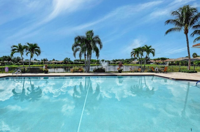 view of pool featuring a water view