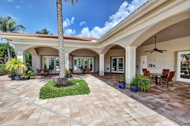 view of patio with french doors and ceiling fan