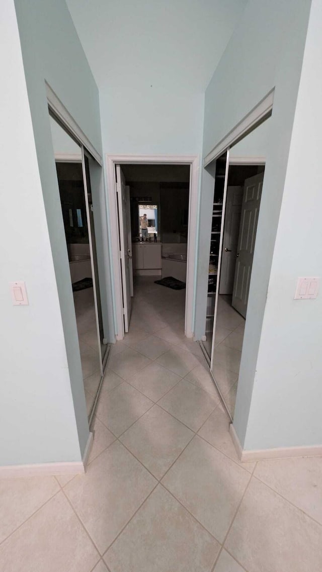 hallway with light tile patterned flooring