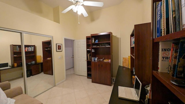 office area featuring ceiling fan and a towering ceiling