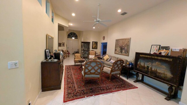 tiled dining area featuring a tray ceiling and a notable chandelier