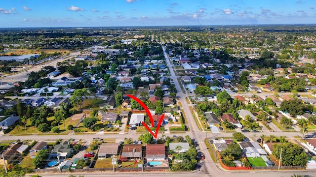 birds eye view of property with a residential view