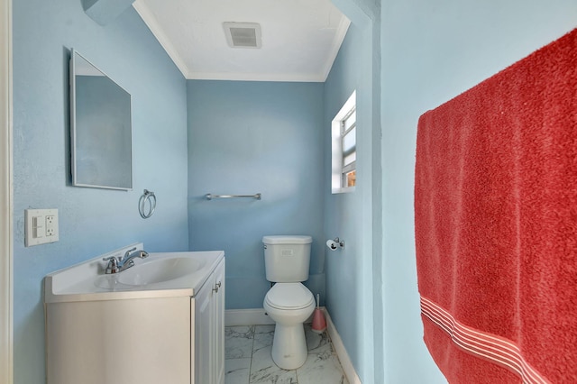 full bath featuring baseboards, toilet, marble finish floor, crown molding, and vanity