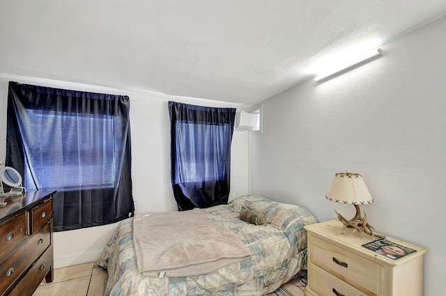 bedroom with light tile patterned floors