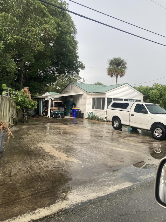 view of front of house with a carport