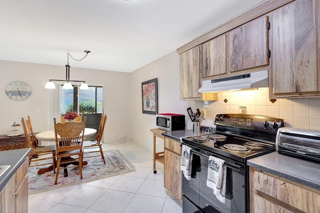 kitchen with electric range, decorative backsplash, light tile patterned floors, decorative light fixtures, and a chandelier