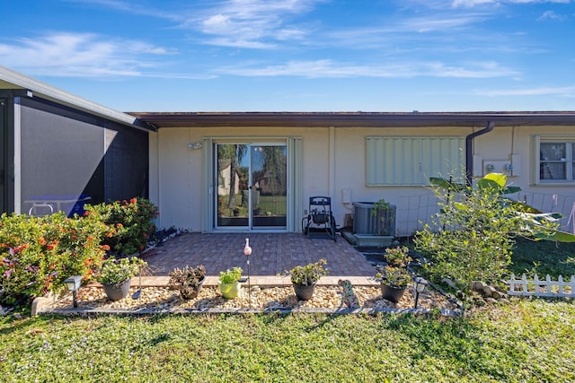 back of house with a patio and central AC unit