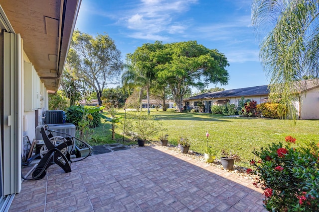 view of patio with central AC unit