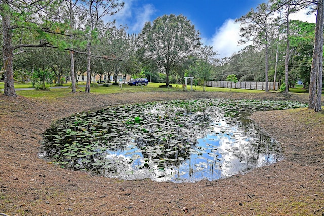 surrounding community with a water view