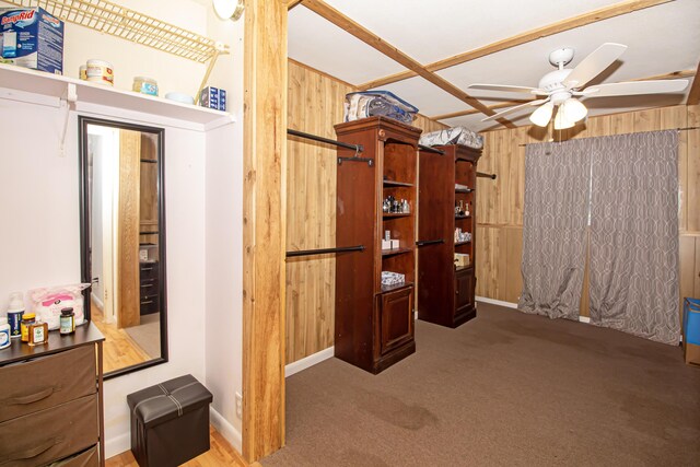 interior space with wood walls and light carpet