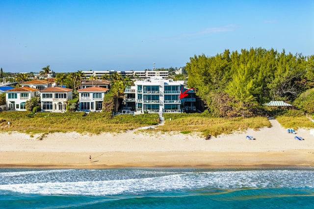 aerial view featuring a view of the beach and a water view