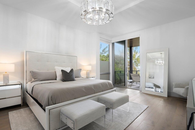 bedroom with access to exterior, a notable chandelier, and wood-type flooring