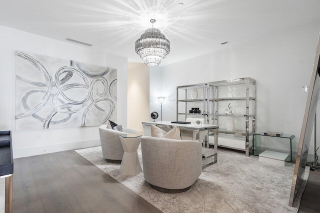 living room with a chandelier and hardwood / wood-style floors