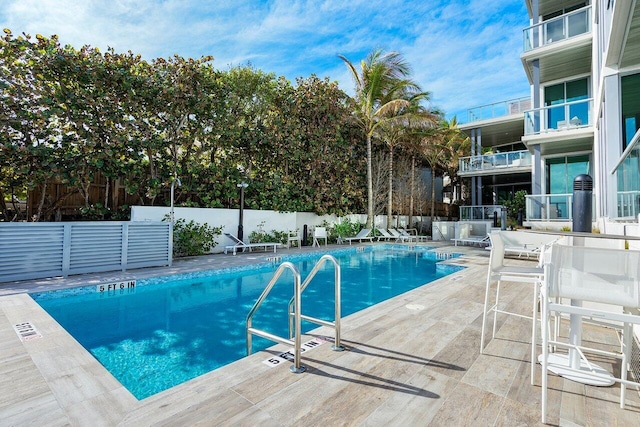 view of swimming pool with a patio area