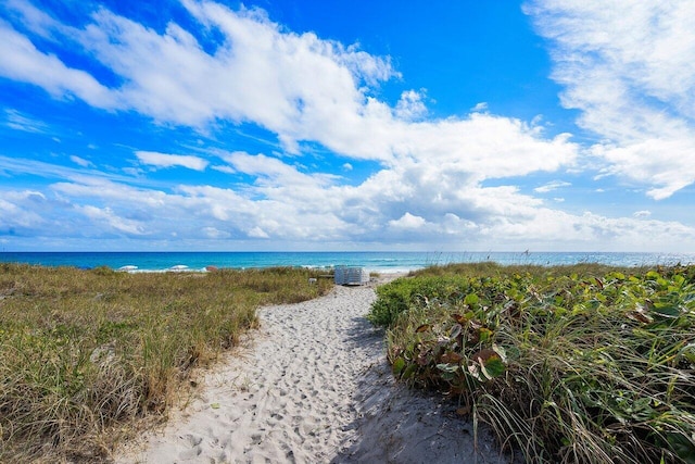 property view of water featuring a beach view