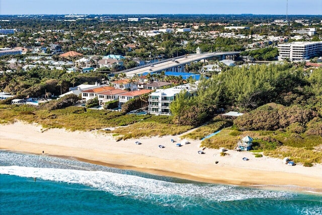 bird's eye view with a water view and a beach view