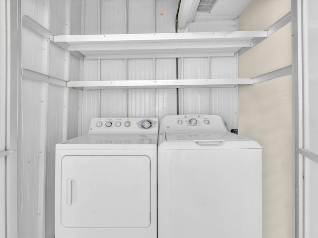 washroom featuring washer and clothes dryer