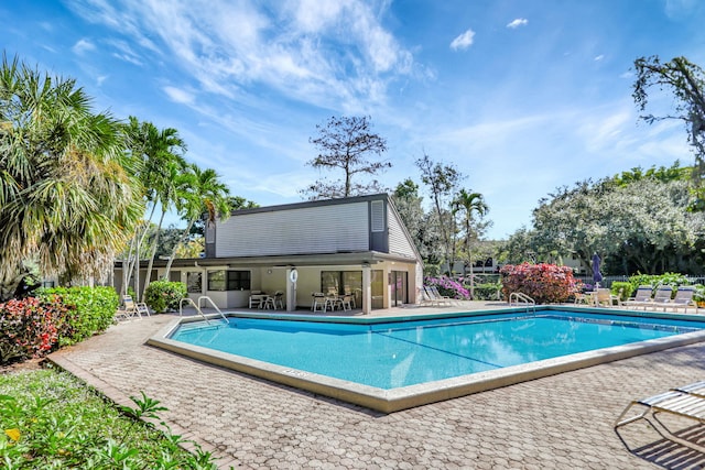 view of swimming pool featuring a patio area