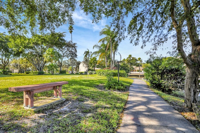 surrounding community featuring a yard