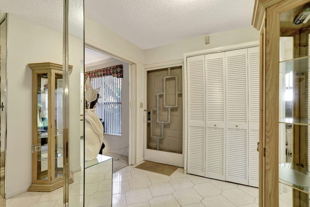 interior space with a textured ceiling