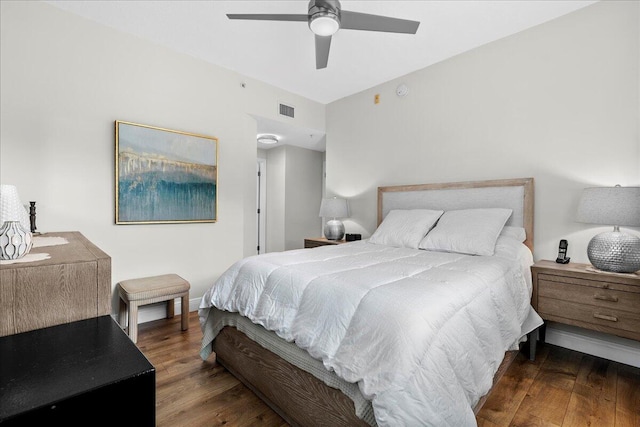 bedroom featuring ceiling fan and dark hardwood / wood-style floors