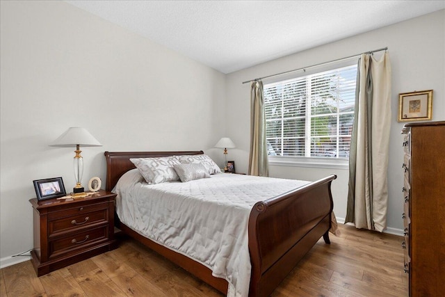 bedroom featuring wood-type flooring