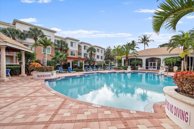 view of swimming pool with a patio area