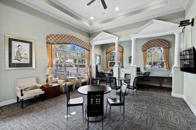 carpeted dining area featuring ceiling fan, ornamental molding, and a wealth of natural light