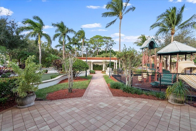 view of property's community with a playground