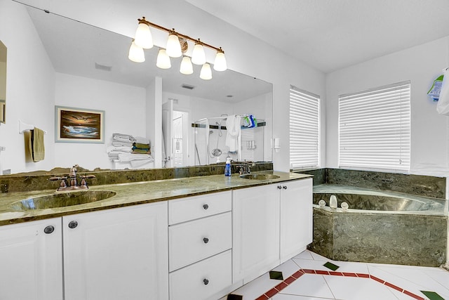 bathroom with tile patterned flooring, vanity, and independent shower and bath