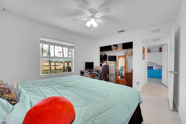 bedroom featuring ceiling fan and a closet