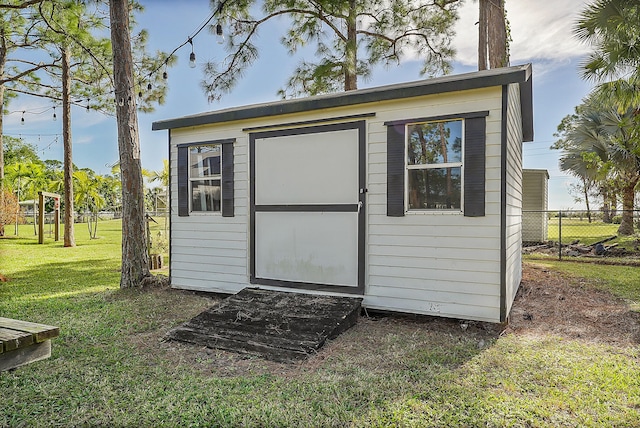 view of outdoor structure featuring a yard