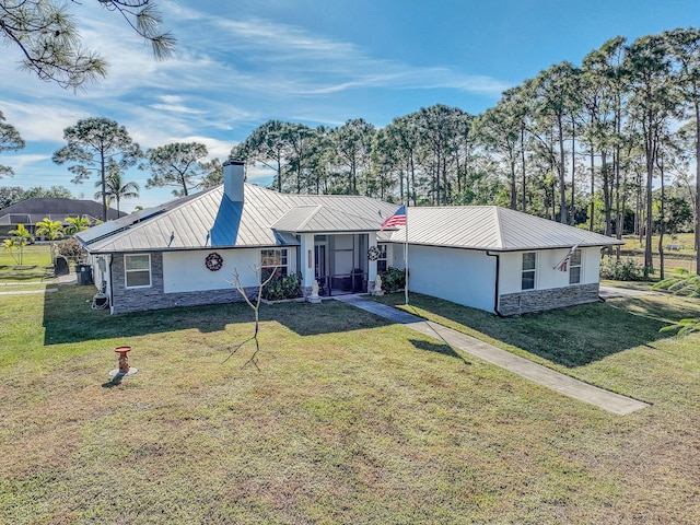 ranch-style home featuring a front yard