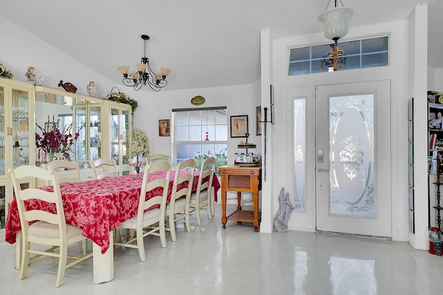 dining space featuring an inviting chandelier