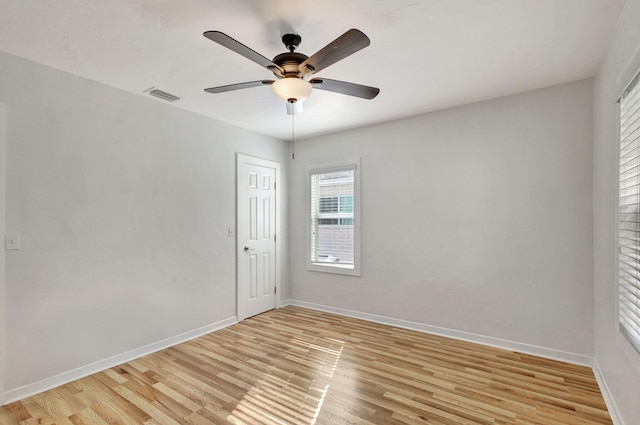 spare room featuring ceiling fan and light wood-type flooring