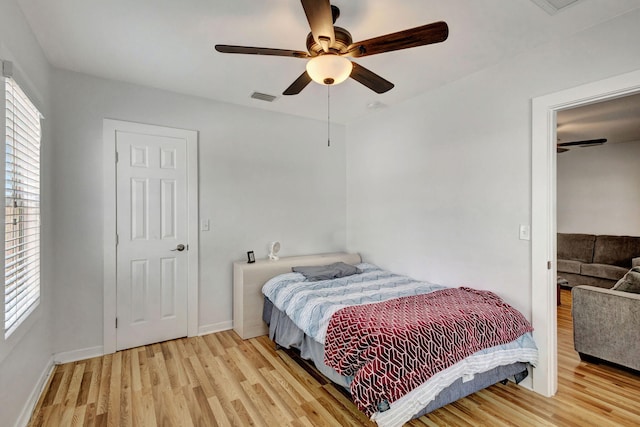 bedroom featuring light hardwood / wood-style floors and ceiling fan