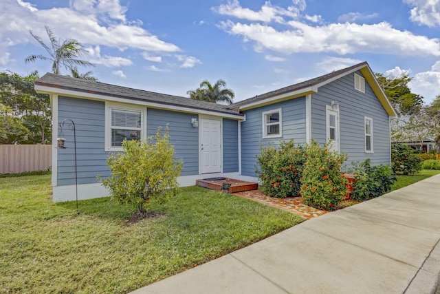 view of front of property with a front lawn