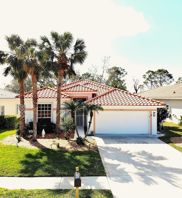 mediterranean / spanish-style house with a garage and a front lawn