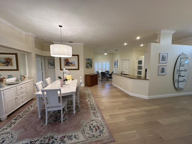 bathroom with hardwood / wood-style floors, vanity, shower with separate bathtub, and crown molding