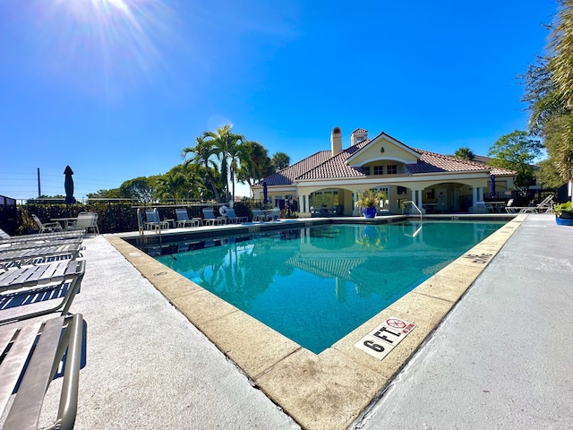 view of pool featuring a patio area