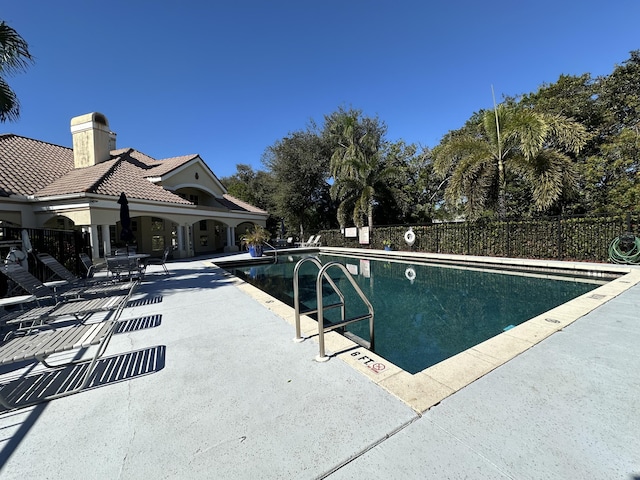 view of swimming pool featuring a patio area