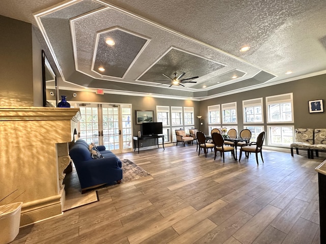 interior space featuring plenty of natural light, a textured ceiling, and hardwood / wood-style flooring