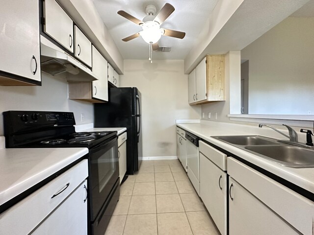 kitchen featuring ceiling fan, sink, black appliances, white cabinetry, and light tile patterned flooring