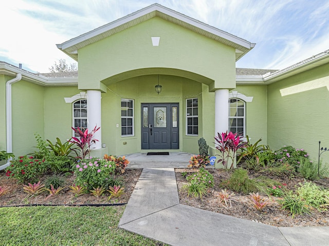 doorway to property featuring a porch