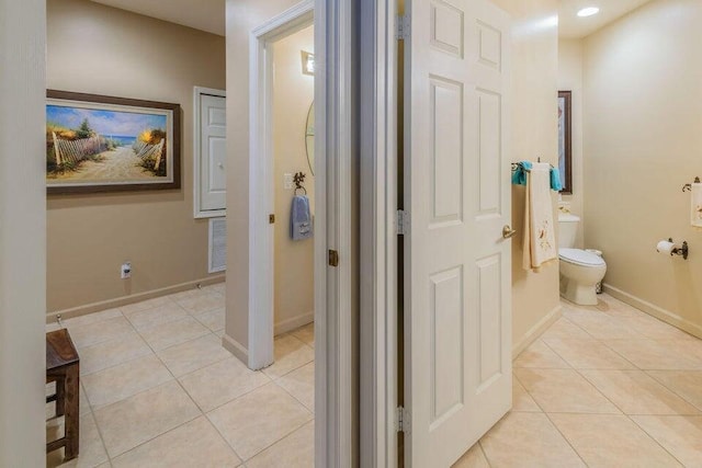 bathroom with tile patterned floors and toilet