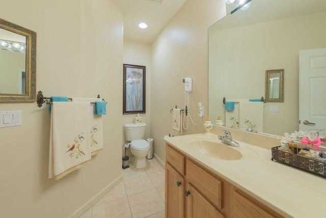 bathroom with tile patterned flooring, vanity, and toilet