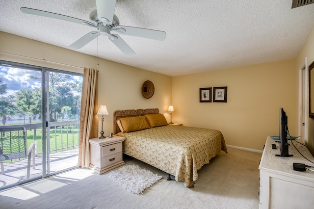 bedroom with light carpet, a textured ceiling, access to outside, and ceiling fan