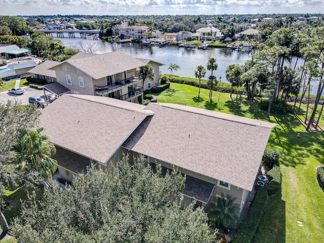 birds eye view of property with a water view